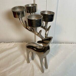 Silver tone reindeer decoration. Holds four tea lights